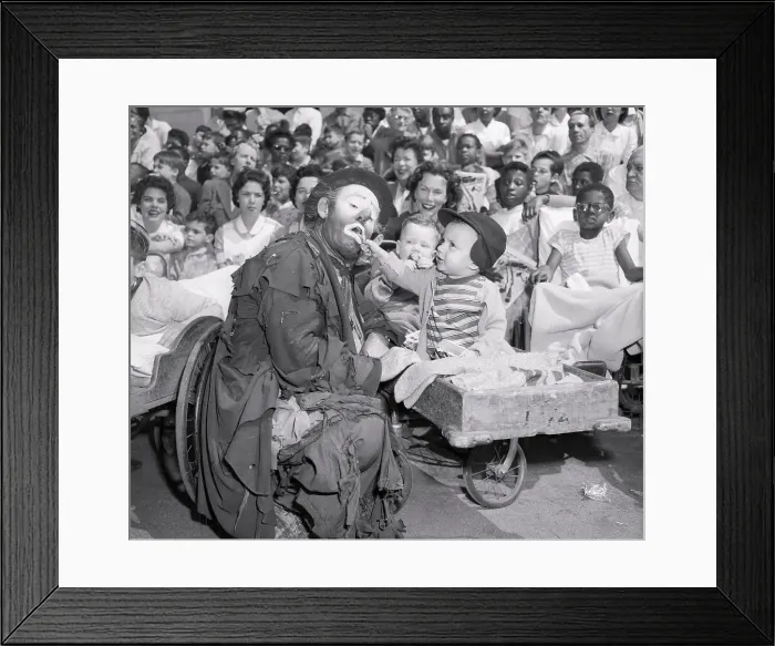 Framed Print : Child Feeding Clown Framed Print : Child Feeding Clown