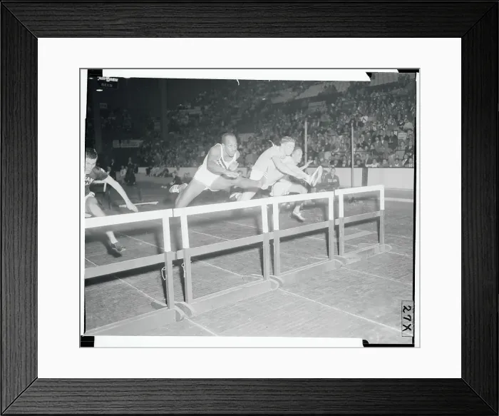 Framed Print : Athletes Jumping over Hurdles Framed Print : Athletes Jumping over Hurdles