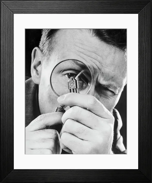 Framed Print : Man Examining a Diamond Pointed Tool Framed Print : Man Examining a Diamond Pointed Tool