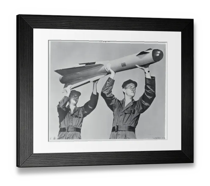 Framed Print : Two Men Holding a Falcon Missile Framed Print : Two Men Holding a Falcon Missile