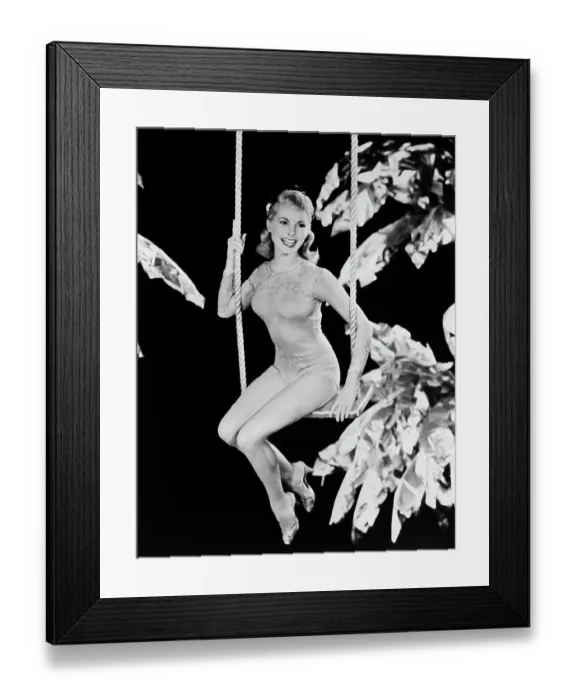 Framed Print : Janet Leigh Perched on a Swing Framed Print : Janet Leigh Perched on a Swing