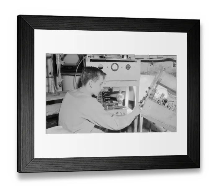 Framed Print : Boy Adjusting an Oscilloscope Framed Print : Boy Adjusting an Oscilloscope