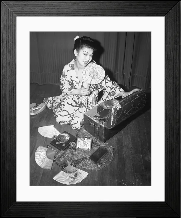 Framed Print : Japanese Woman Looking at Her Mementos Framed Print : Japanese Woman Looking at Her Mementos