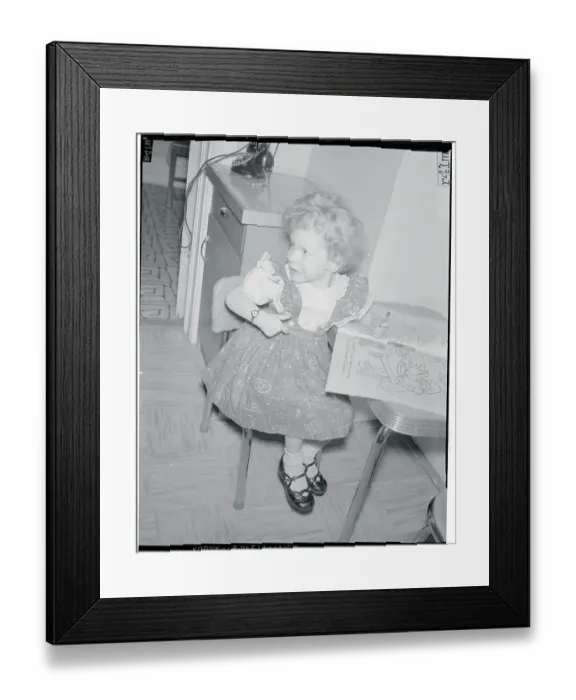 Framed Print : Girl at Table with Coloring Book Framed Print : Girl at Table with Coloring Book