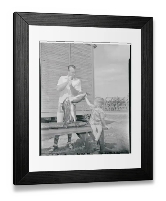 Framed Print : Duke and Kevin Snider Admiring Fish Framed Print : Duke and Kevin Snider Admiring Fish