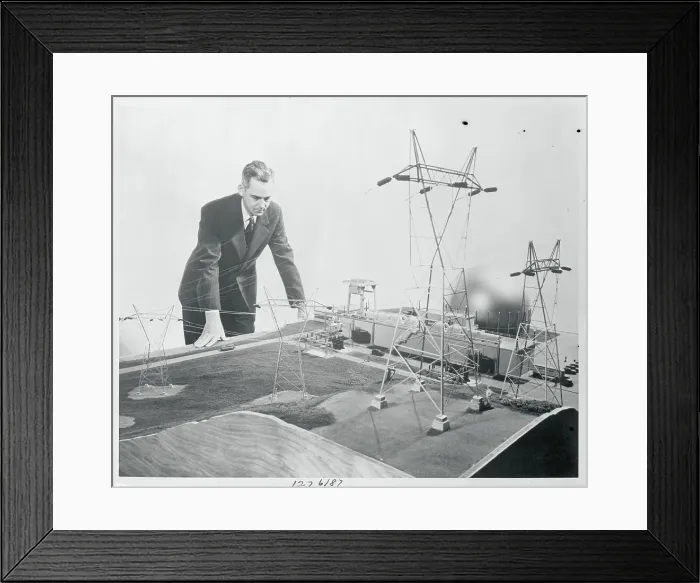 Framed Print : Man Inspecting Model Atomic Plant Framed Print : Man Inspecting Model Atomic Plant