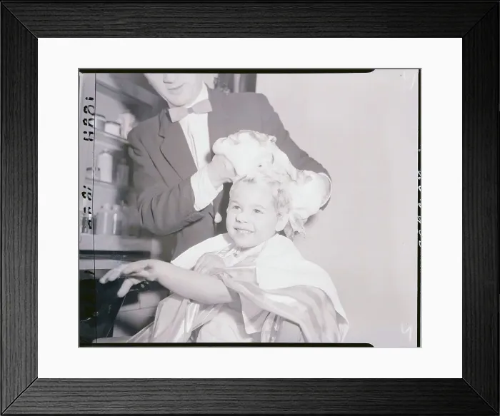 Framed Print : Hair Stylist Shampooing a Girl's Hair Framed Print : Hair Stylist Shampooing a Girl's Hair