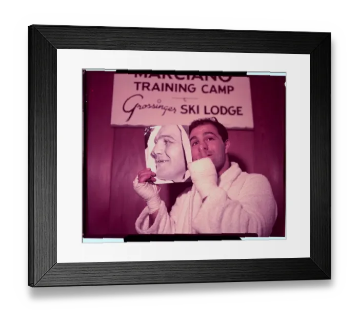 Framed Print : Rocky Marciano Holding Photo Framed Print : Rocky Marciano Holding Photo