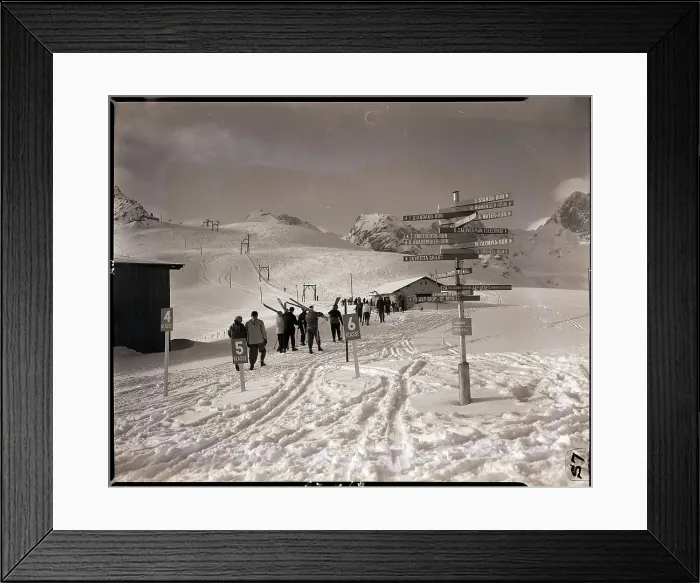 Framed Print : Skiers Walking Down Hill Towards Base Framed Print : Skiers Walking Down Hill Towards Base