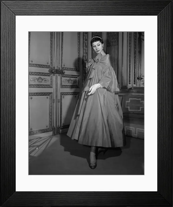 Framed Print : Female Model Posing in Elegant Long Overcoat Framed Print : Female Model Posing in Elegant Long Overcoat