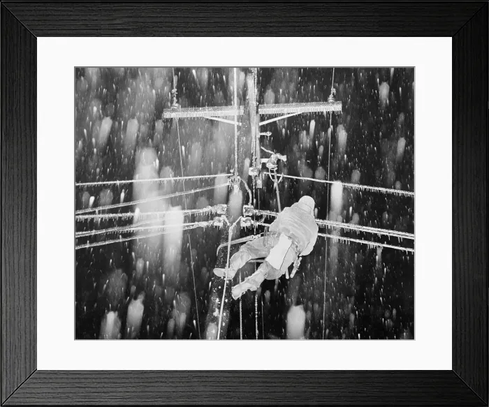Framed Print : Man Repairing Utility Line in Snowfall Framed Print : Man Repairing Utility Line in Snowfall