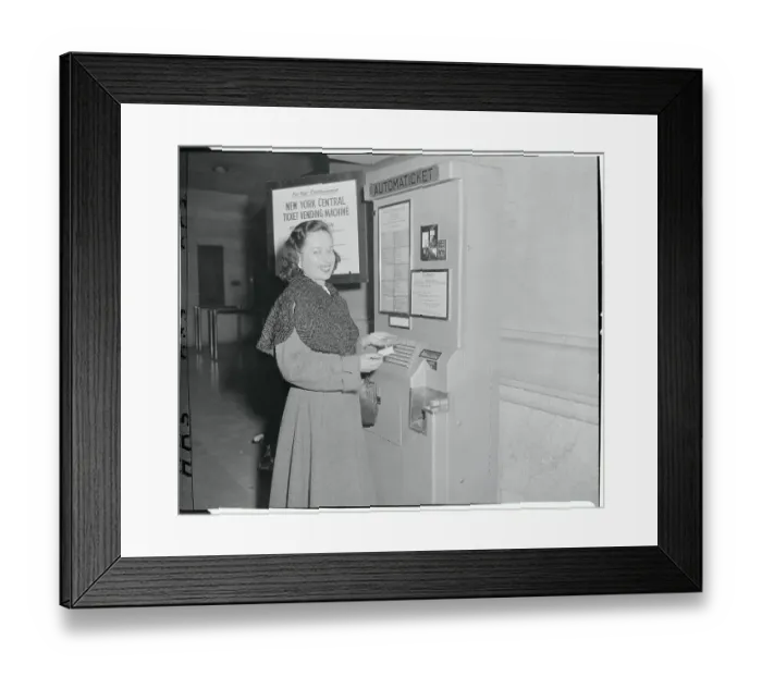 Framed Print : Woman Using a Ticket Vending Machine