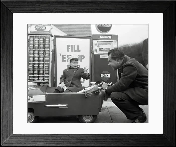 Framed Print : Richard Nixon Servicing a Young Girl's Car Framed Print : Richard Nixon Servicing a Young Girl's Car