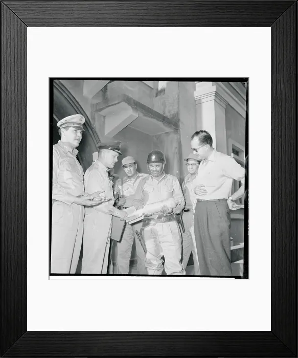 Framed Print : Marciano Aguiluz Holding a Bomb Framed Print : Marciano Aguiluz Holding a Bomb
