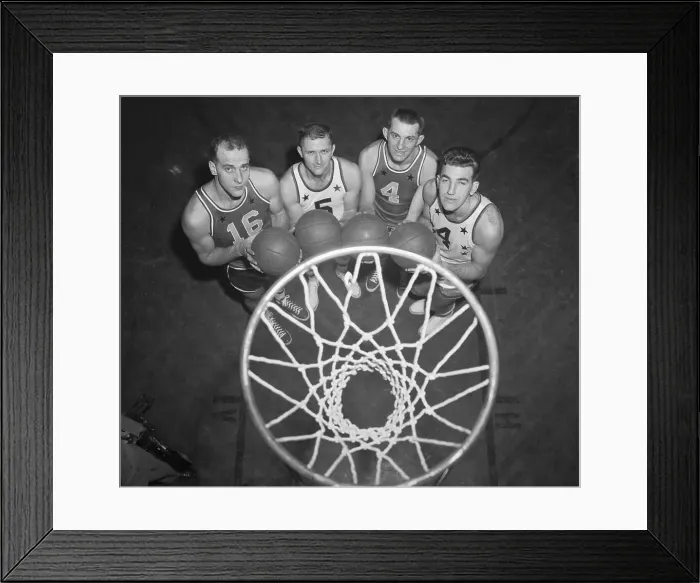 Framed Print : Basketball Players Posing Underneath the Net Framed Print : Basketball Players Posing Underneath the Net