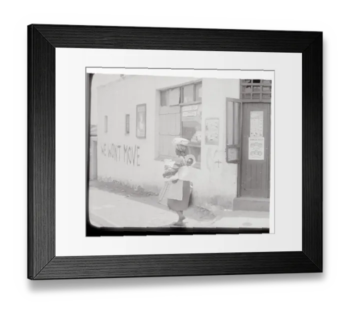 Framed Print : Slogan Painted on the Side of a Store Framed Print : Slogan Painted on the Side of a Store