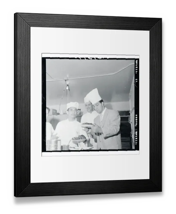 Framed Print : Rocky Marciano Inspecting a Steak Framed Print : Rocky Marciano Inspecting a Steak