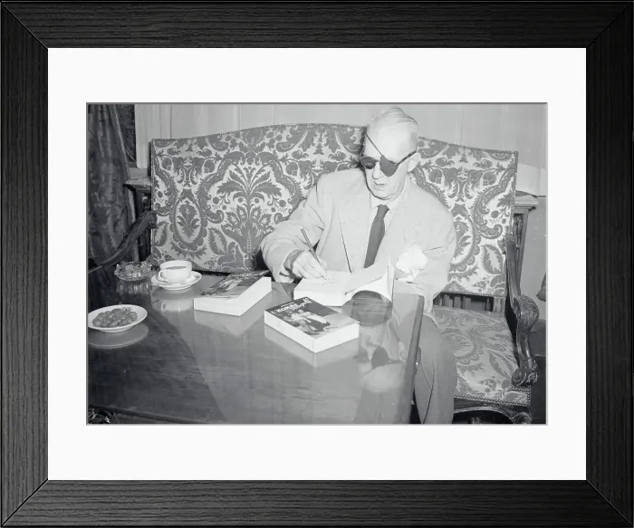 Framed Print : John Ford Autographing One of His Books Framed Print : John Ford Autographing One of His Books