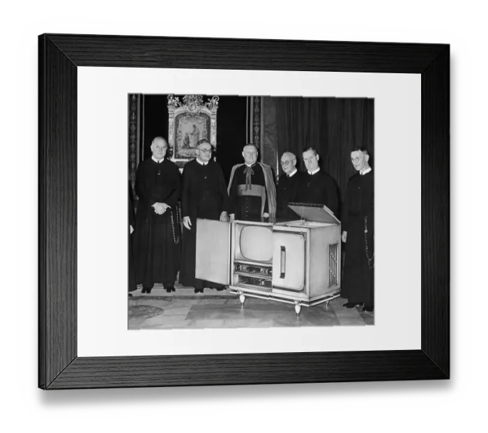 Framed Print : Angello Dell Acqua Inspecting a Television