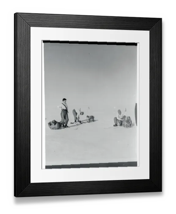 Framed Print : Men Adjusting Their Skis Framed Print : Men Adjusting Their Skis