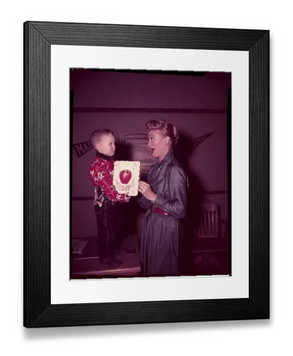 Framed Print : Eve Arden Gasping at Gift from Young Boy Framed Print : Eve Arden Gasping at Gift from Young Boy