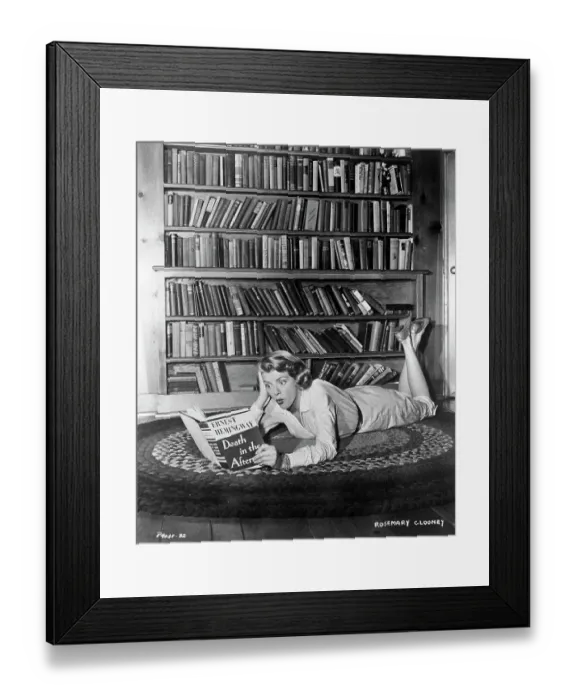 Framed Print : Rosemary Clooney Reading a Book Framed Print : Rosemary Clooney Reading a Book