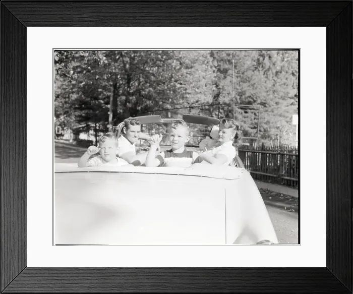 Framed Print : Family Seated in Convertible