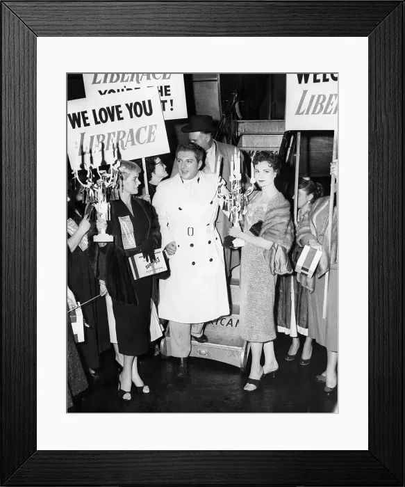 Framed Print : Liberace is flanked by candelabra-bearing fans Marie Miskis Framed Print : Liberace is flanked by candelabra-bearing fans Marie Miskis
