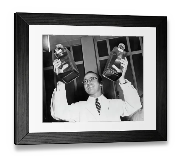Framed Print : Jonas Salk Holding Bottles of Polio Vaccine Framed Print : Jonas Salk Holding Bottles of Polio Vaccine