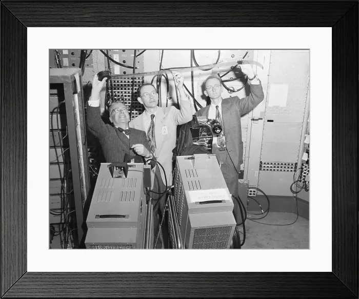 Framed Print : Three Physicists Look At Film Strip Framed Print : Three Physicists Look At Film Strip