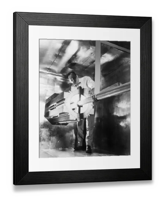 Framed Print : Man Standing Next to a Reactor