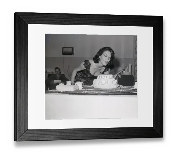 Framed Print : Ava Gardner Blowing out Candle on Birthday Cake Framed Print : Ava Gardner Blowing out Candle on Birthday Cake