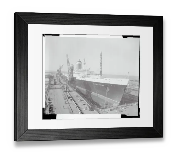 Framed Print : The S.S. United States Sitting at a Building Dock Framed Print : The S.S. United States Sitting at a Building Dock