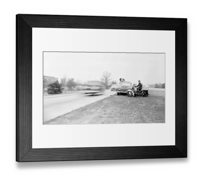 Framed Print : Motorcycle Police Officer Watching for Speeders Framed Print : Motorcycle Police Officer Watching for Speeders