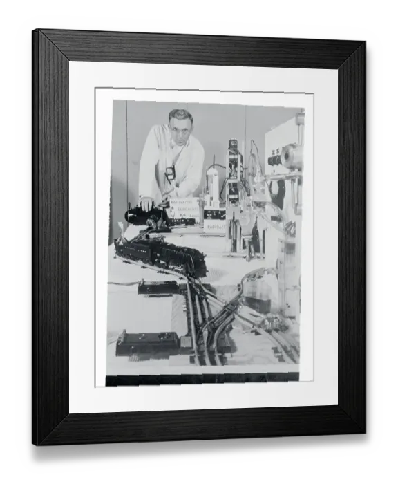 Framed Print : Man Operating a Toy Train Framed Print : Man Operating a Toy Train