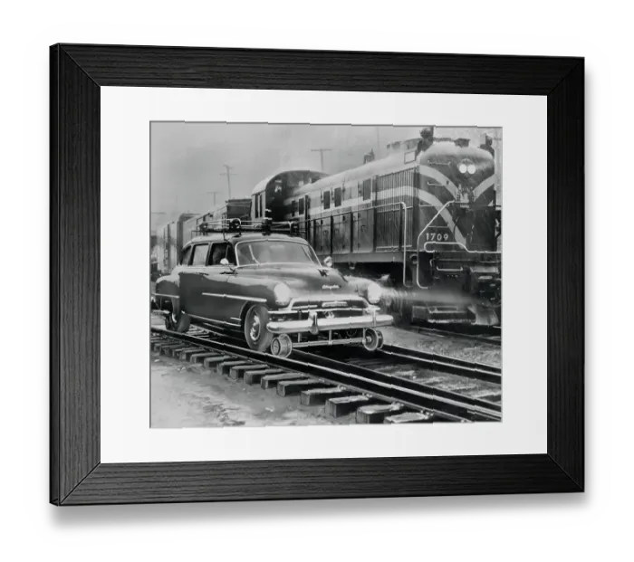 Framed Print : Car Riding the Rails Next to a Train Framed Print : Car Riding the Rails Next to a Train