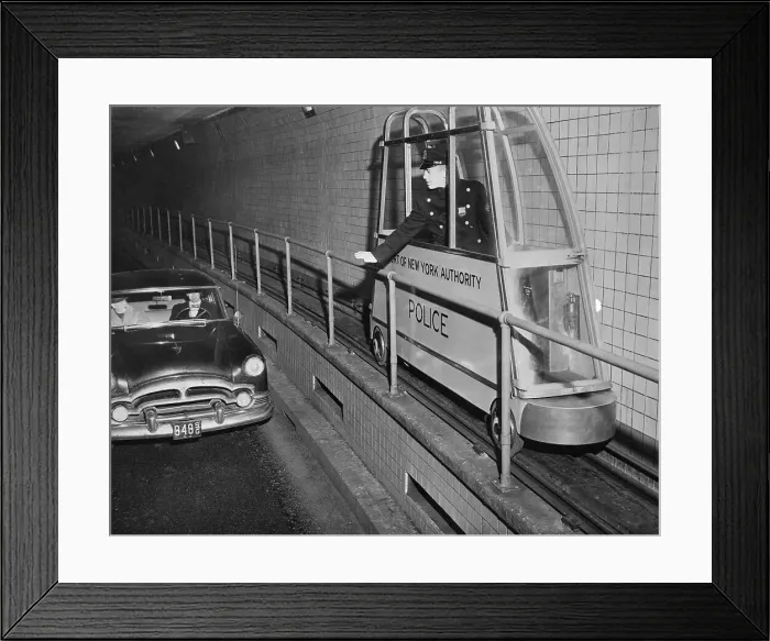 Framed Print : Policeman Driving a Catwalk Car