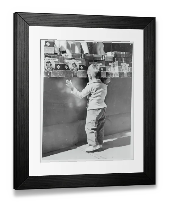 Framed Print : Boy Searching a Toy Counter Framed Print : Boy Searching a Toy Counter