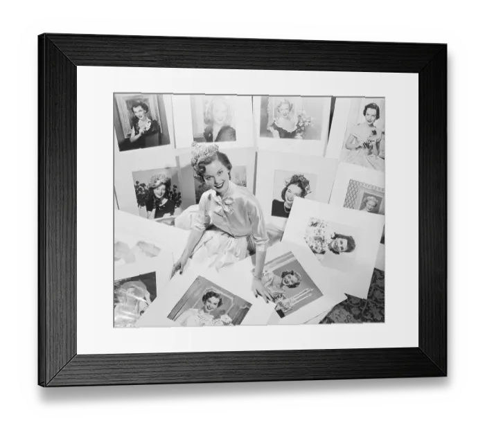 Framed Print : Beauty Contestant Surrounded by Photographs Framed Print : Beauty Contestant Surrounded by Photographs