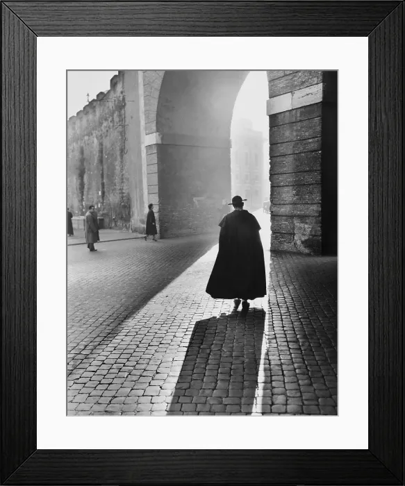 Framed Print : Young Priest Walks Toward an Arch Framed Print : Young Priest Walks Toward an Arch