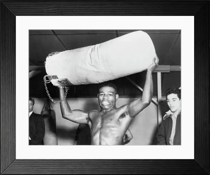 Framed Print : Teddy Davis Holding a Punching Bag Framed Print : Teddy Davis Holding a Punching Bag