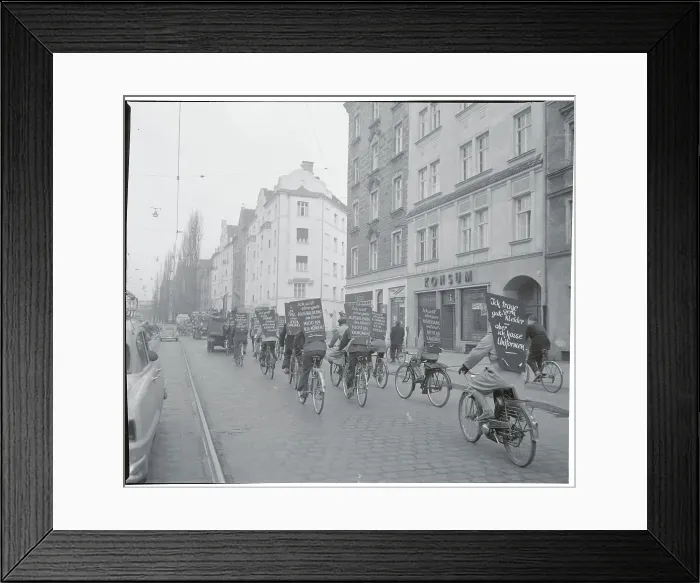 Framed Print : Bicyclists Riding through Munich Framed Print : Bicyclists Riding through Munich