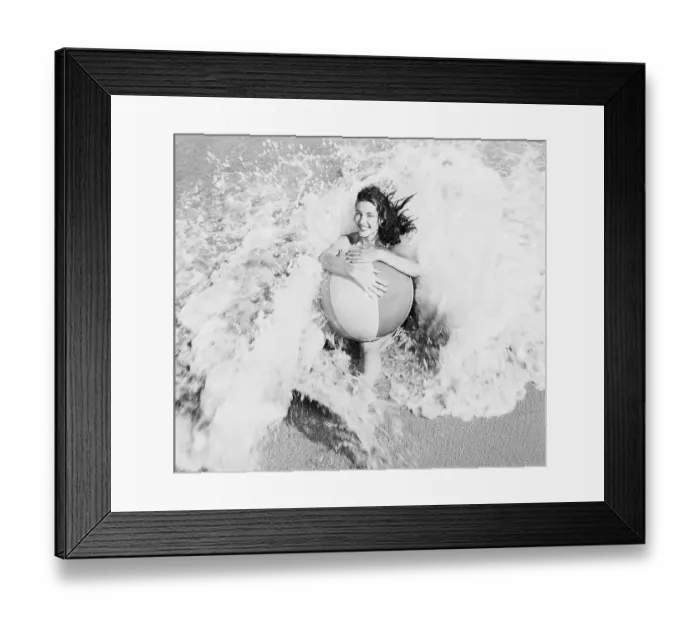 Framed Print : Young Woman with Beach Ball in Surf Framed Print : Young Woman with Beach Ball in Surf