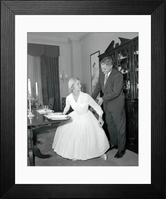 Framed Print : Man Holding a Woman's Chair
