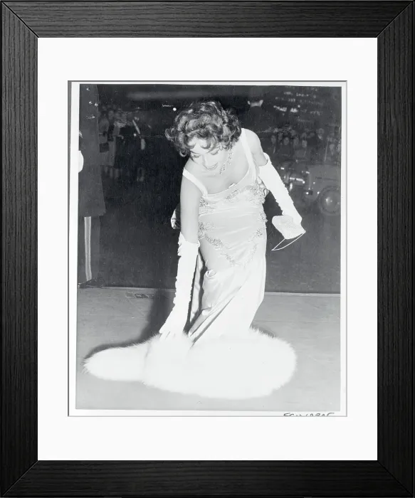 Framed Print : Mara Land Picking Up Her Fur Piece