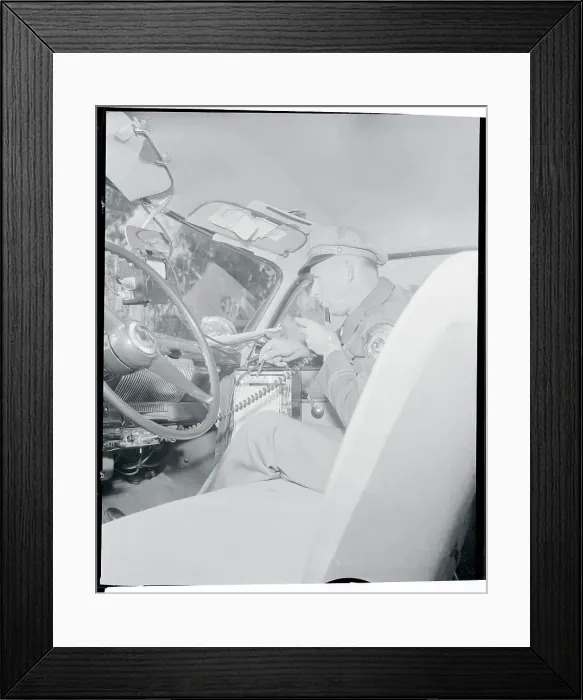 Framed Print : Officer Using a Radio Framed Print : Officer Using a Radio