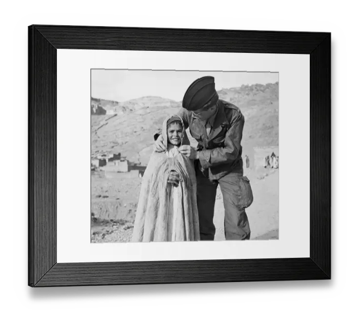 Framed Print : Soldier Adjusting Cape for Youngster Framed Print : Soldier Adjusting Cape for Youngster