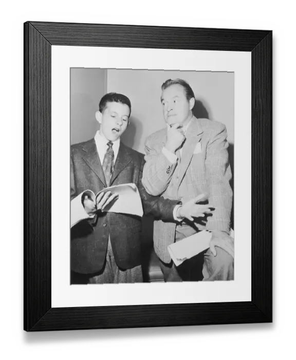 Framed Print : Bob Hope Listening to His Son