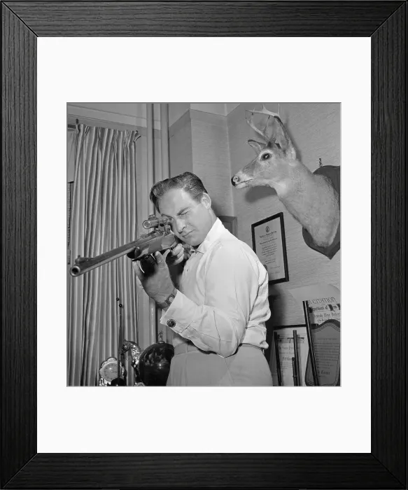 Framed Print : Sid Caesar Holding Rifle Framed Print : Sid Caesar Holding Rifle