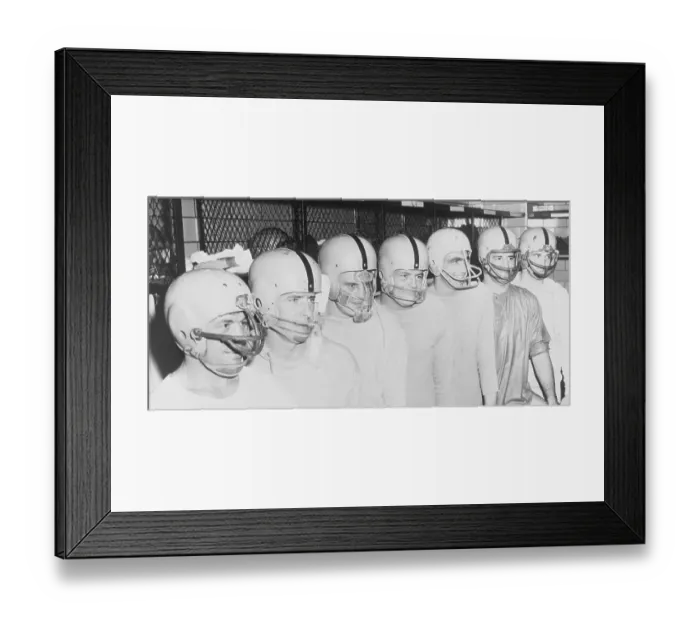 Framed Print : Football Players Standing in a Row and Wearing Helmets Framed Print : Football Players Standing in a Row and Wearing Helmets